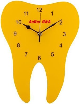 Hodiny ve tvaru zubu, žluté